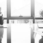 board members talking - black and white