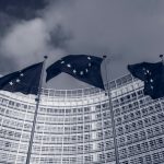 Flags of the European Union in front of the EU-commission building "Berlaymont" in Brussels, Belgium