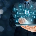 Businessman holding a tablet for Corporate data management system