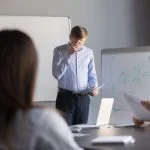nervous employee wipe face scared to speak in public. Person with stage fright
