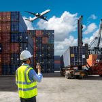 Foreman control loading Containers box to truck for Logistic Import and cargo