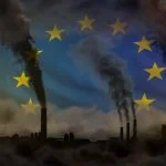 dense smoke from industry pipes for decarbonization on European Union flag