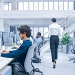 Beautiful Female Manager is Walking Pass Her Business Colleagues while working, experiments to optimize AI and algorithmic attachments.