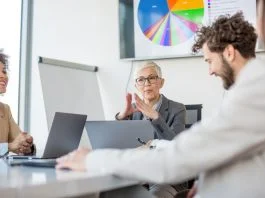 CEO using technology for presenting data