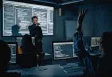 Teacher Giving Computer Science Lecture to Diverse Multiethnic Group in Business Schools