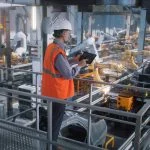 Manufacturing Plants - worker controlling production line
