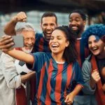 Player of sports and fans taking a selfie