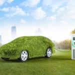 Green ev car or leafy grass electric vehicle recharging at station