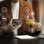 Closeup women holding hand credit card. Businessman use smartphone online payments shopping in the morning.