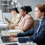 Women in Tech Working on Computers in Office