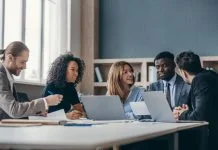Master’s in Management (mim) students studying in library