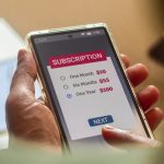 Consumer Behaviour in the Digital Age. Man choosing a subscription plan for one year using mobile applications