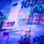 Euro banknotes with stock market chart graph