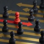 Red pawn facing different position for leadership transformation
