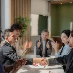 Business people shaking hands after negotiation