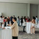 Diverse professionals networking and socializing at a business event