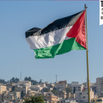 The large Palestinian flag is waiving above the city.